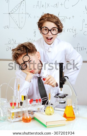 Similar – Image, Stock Photo boy is making science experiments in a laboratory