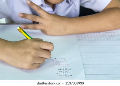Students Doing Math Test By Count Fingers - Shutterstock ID 1137308930