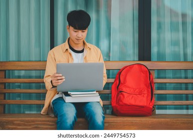 Students are doing research and finding knowledge on the internet on laptops in the university area.