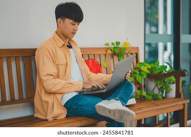 Students are doing research and finding knowledge on the internet on laptops in the university area.