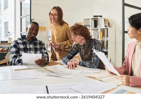 Students engaging in collaborative learning, discussing foreign language materials in a classroom setting. Multiracial group studying together, fostering diverse and inclusive environment