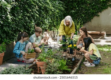 Students and female teacher at outdoor sustainable education class. Kids taking care of plants in school garden. Concept of experiential learning and ecoliteracy. - Powered by Shutterstock