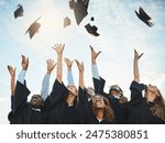 Students, graduation and caps in sky with happiness, university achievement or ceremony or excited people. Academic, goals and college degree completion, education success and excellence celebration