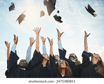 Students, graduation and caps in sky with happiness, university achievement or ceremony or excited people. Academic, goals and college degree completion, education success and excellence celebration - Powered by Shutterstock