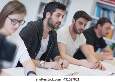 students group study together in school classroom and working together homework project - Shutterstock ID 431027821