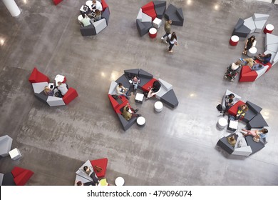 Students Groups Sitting In A Modern University Atrium