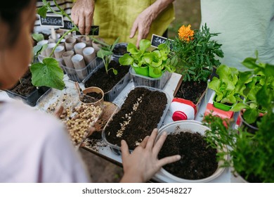 Students growing vegetable and herb seedlings. Outdoor sustainable education class in school garden. Concept of experiential learning and ecoliteracy. - Powered by Shutterstock