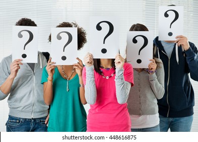 Students Hiding There Face With Question Mark Sign, Uncertainty Of Their Future Concept
