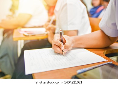 Students Holding Pen Writing In The Learning Classroom; Education Concept Photography Of Learners In Training Session Program At The Career Development Center Of The Technical Or Vocational College