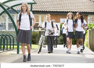 Students Leaving School One With A Bicycle