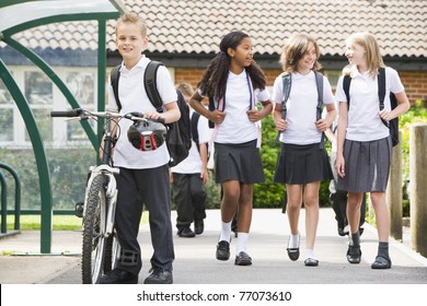 Students Leaving School One With A Bicycle