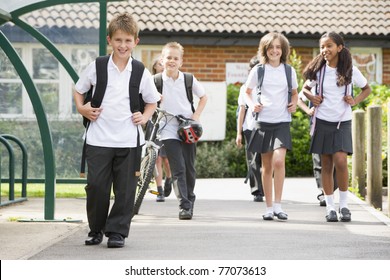 Students Leaving School One With A Bicycle