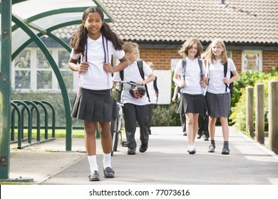 Students Leaving School One With A Bicycle