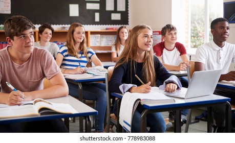 Students Listening To Female Teacher In Classroom - Shutterstock ID 778983088