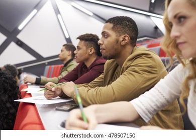 Students Listening To Lecture At University Lecture Theatre