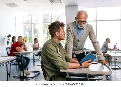 Students listening to an older high school teacher. - Powered by Shutterstock