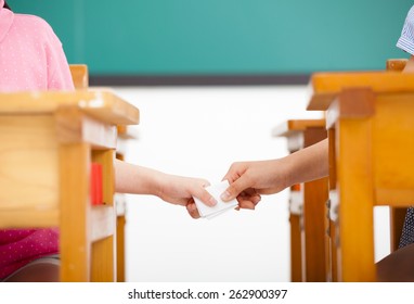 Students Passing Notes In The Classroom