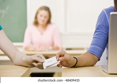 Students Passing Notes In Classroom