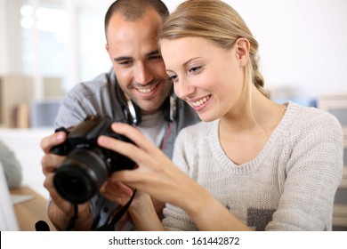 Students in photography working together on project - Powered by Shutterstock