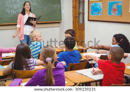 Students pointing at fellow classmate at the elementary school