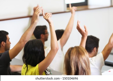 Students Put Hand Up In Class Room