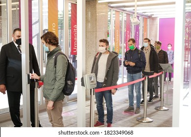 Students Queuing Up At The University Entrance Wear Covid Masks. Turin, Italy - September 2020