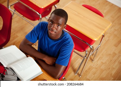 Students: Serious African American Teen Male At Desk In Class