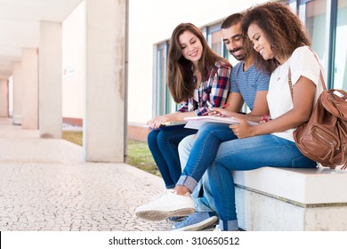 Students Sharing Notes In The University Campus