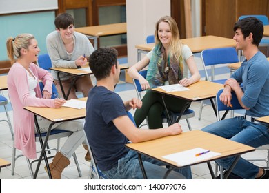 Students Sitting In A Classroom And Talking While Having Fun