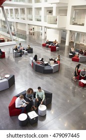 Students Sitting In University Atrium, Vertical