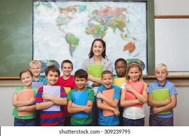 Students standing with the teacher at the elementary school