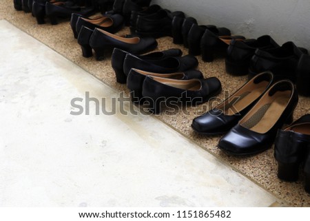 Students take off the casual shoes front of classroom to keep clean very disciplined. Many leather shoes in the first semester school concept.