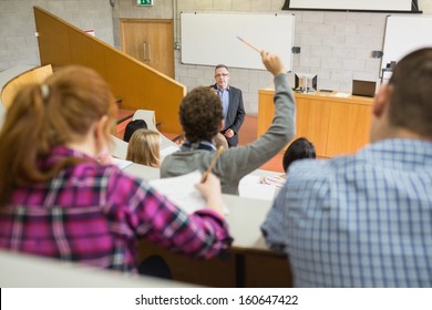 Students with a teacher at the college lecture hall
