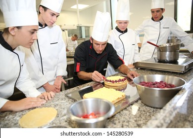 Students with teacher in pastry training course