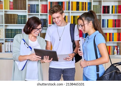 Students teenagers talking with woman teacher mentor - Shutterstock ID 2138465101