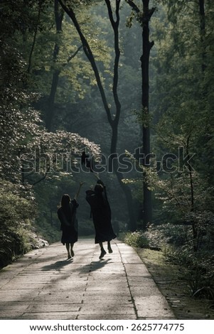 Students Tossing Graduation Caps While Running Toward the Future – Celebrating University Graduation