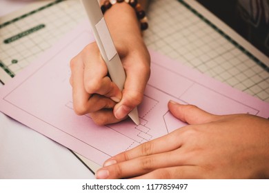 Students are using plastic stick on paper pop-up.