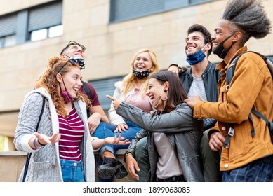 students of various nationalities joking with each other, resumption of normal social life with the protection of face masks, concept of optimism, positive view of the future - Shutterstock ID 1899063085