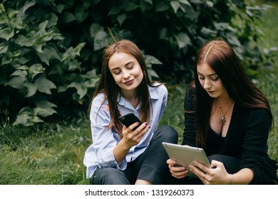 Students Walking And Talking And Use Tablet