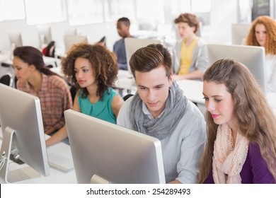 Students Working In Computer Room At The College