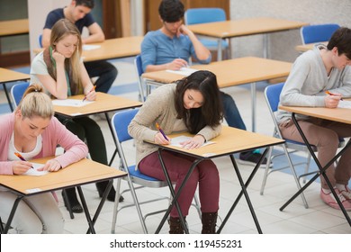 Students Writing In The Exam Hall Of The College