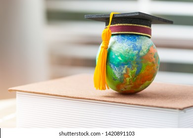 Studies at Home when covid-19,coronavirus outbreak disease 2019 concept, Education to learn study in world while Pandemic. Graduated student studying abroad international Master degree hat on globe