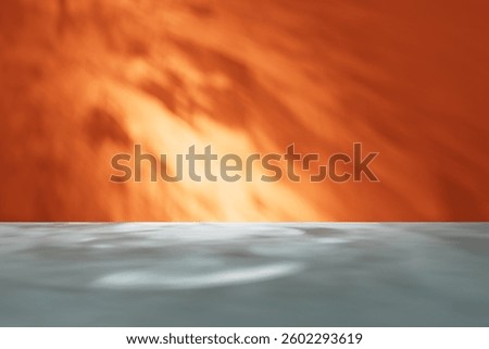 Studio background for display product. Empty room with shadows, caustics and soft lighting for product presentation. Minimalistic showcase for advertisement with orange wall and gray floor.