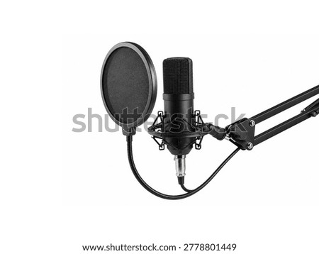 Studio condenser microphone with pop filter on boom arm isolated on white background.