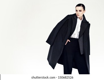 Studio Fashion Portrait Of Yong Pretty Woman In Black Coat