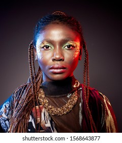 Studio Fashion Portrait Of Young African Ethnicity Woman With Shiny Make Up. Face Close Up. Neon Red And Blue Duotone Trendy Light And Toning.