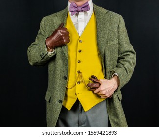 Studio Image Of Man In Vintage Suit Standing Proudly. Concept Of Classic And Eccentric British Gentleman Stereotype. Retro Style And Fashion