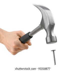 Studio isolated hammer hitting a nail, with partial motion blur at the tool's top