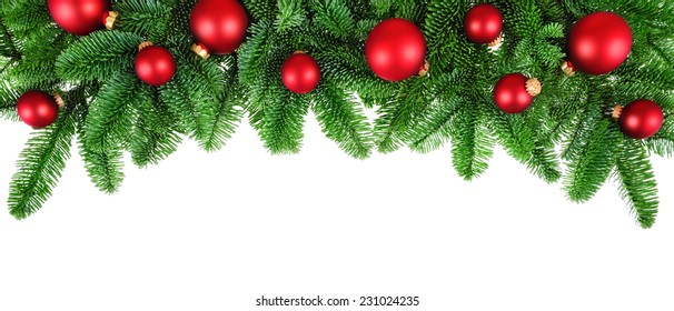 Studio Isolated Lush Fir Twigs With Red Baubles As A Bow-shaped Border On Pure White Background