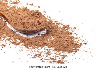 Studio Lighting. Allspice On A Wooden Spoon, On A White Background. There Is A Shadow. Close-up. No Isolation